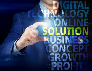 Businessman presses button  solution on virtual screens. Busines