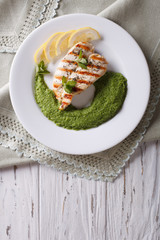 chicken and a side dish of green peas  vertical top view
