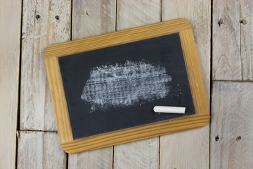 Small blackboard with white chalk