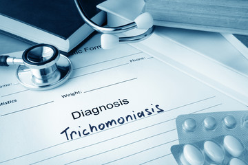 Diagnostic form with diagnosis Trichomoniasis  and pills.