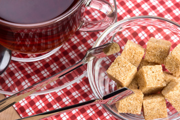 brown cane sugar and a cup of tea