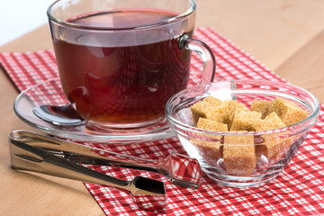 brown cane sugar and a cup of tea