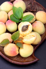 Apricot. Ripe apricots on a wooden tray