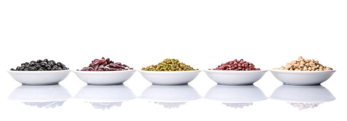 Beans variety in white bowl over white background