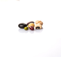 Variety of beans over white background