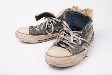 Old & Torn shoes isolated on white background