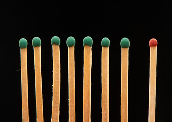 Set of seven green and one red wooden matches