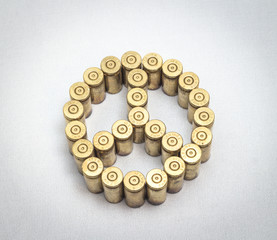 peace symbol formed by bullets