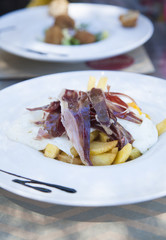 french fries eggs and iberian ham