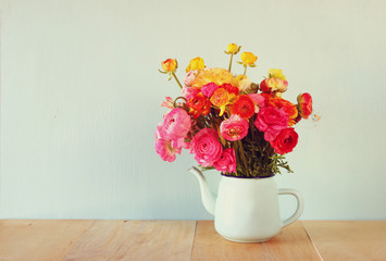 summer bouquet of pink and white flowers on the wooden table