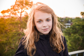 Naklejka premium Caucasian blond girl with bright evening sunlight