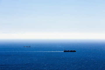 Fototapeta na wymiar Cargo ships with containers in ocean