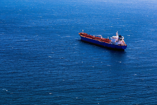 Container cargo ship in blue ocean