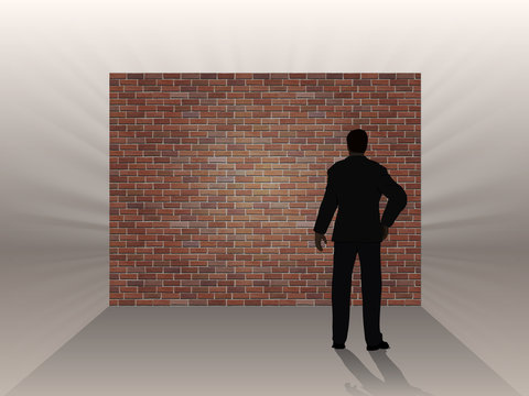 Brick wall and thinking man