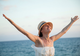 Happy woman  rejoices at summer vacation