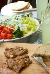 Cut pork steak with vegetable on garden party