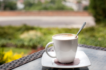 Cup of coffee on the balcony. Relax concept
