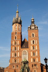 Fototapeta na wymiar Church of St. Mary and the Cloth Hall in the main Market Square of Krakow in Poland.