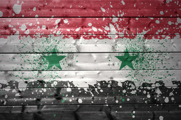 painted syrian flag on a wooden texture