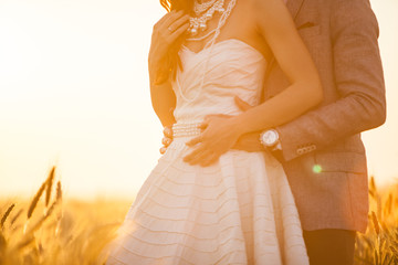 Close up of wedding couple hugging 