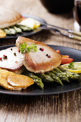 Grilled tuna steak served on asparagus with roasted zmieniakami