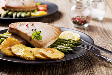 Grilled tuna steak served on asparagus with roasted zmieniakami