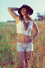 Beautiful girl in a summer field