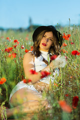 Beautiful girl in a summer field