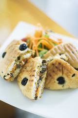 toasted olive bread sandwich with roasted vegetables