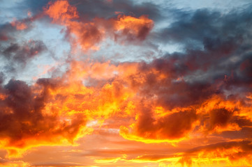 Flaming red fire in the sky cloudscape background