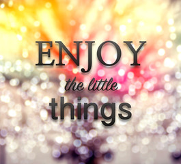 Enjoy the little things quote on bokeh background