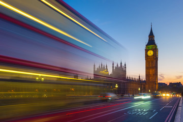 Iconic Double Decker bus with the Big Ben and Parliament at blue hour, London, UK