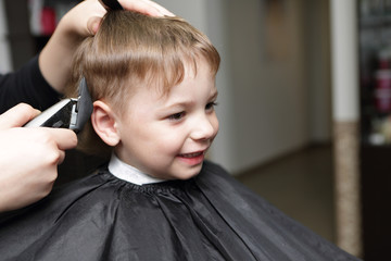 kid at the barbershop