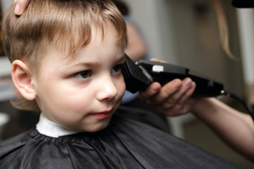 Preschooler at hairdresser salon