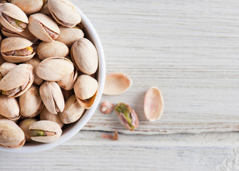 Diet healthcare concept. Roasted pistachio nuts seed with shell close up