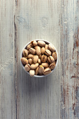 Diet healthcare concept. Roasted pistachio nuts seed with shell close up