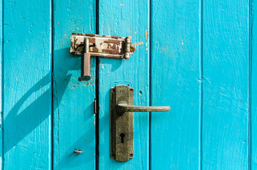 Old door handle with retro wood plank texture background