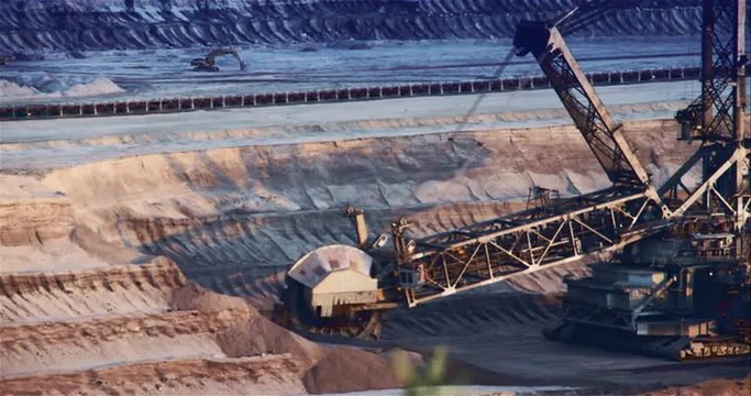 Giant Brown Coal Mine with Bucket Wheel Excavator. Shoot on Digital Cinema Camera in 4k - ProRes 422 codec