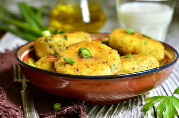 Homemade potato patties with herbs and green onion.