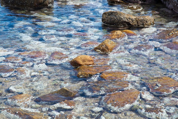 Rocky coast landscape with metamorphic rocks and splashing foaming waves, Southern Province, Sri Lanka, Asia.