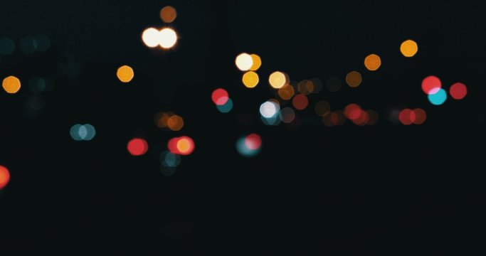 Cars in the night defocused. Blurred street lights