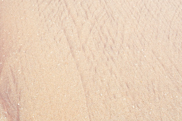 Sand pattern with golden and red sand in Sri Lanka, Asia.