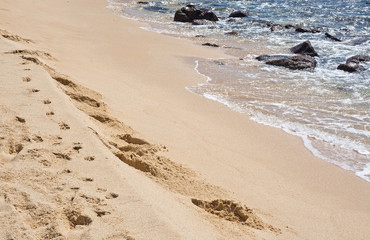 Foot tracks in deep soft sand in Sri Lanka, Asia.