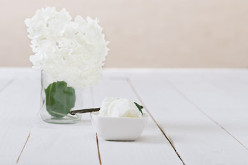 Vanilla Ice Cream on the white wooden table. 