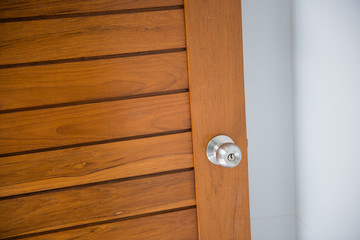 doorknob on the wood door