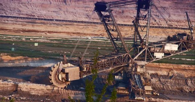 Giant Brown Coal Mine with Bucket Wheel Excavator. Shoot on Digital Cinema Camera in 4k - ProRes 422 codec