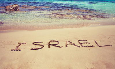 inscription Israel on beach sand