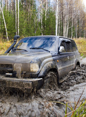 Off road vehicle coming out of a mud hole hazard