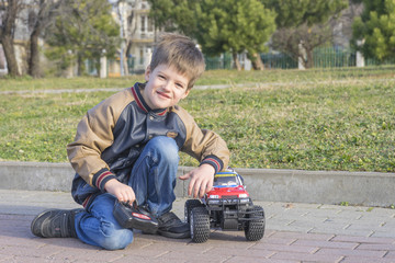 A boy and a toy car