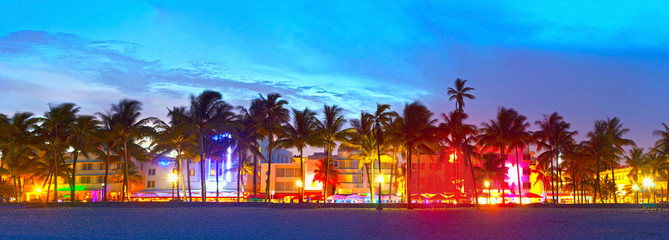 Miami Beach, Florida  hotels and restaurants at sunset on Ocean Drive, world famous destination for it's nightlife, beautiful weather and pristine beaches - obrazy, fototapety, plakaty